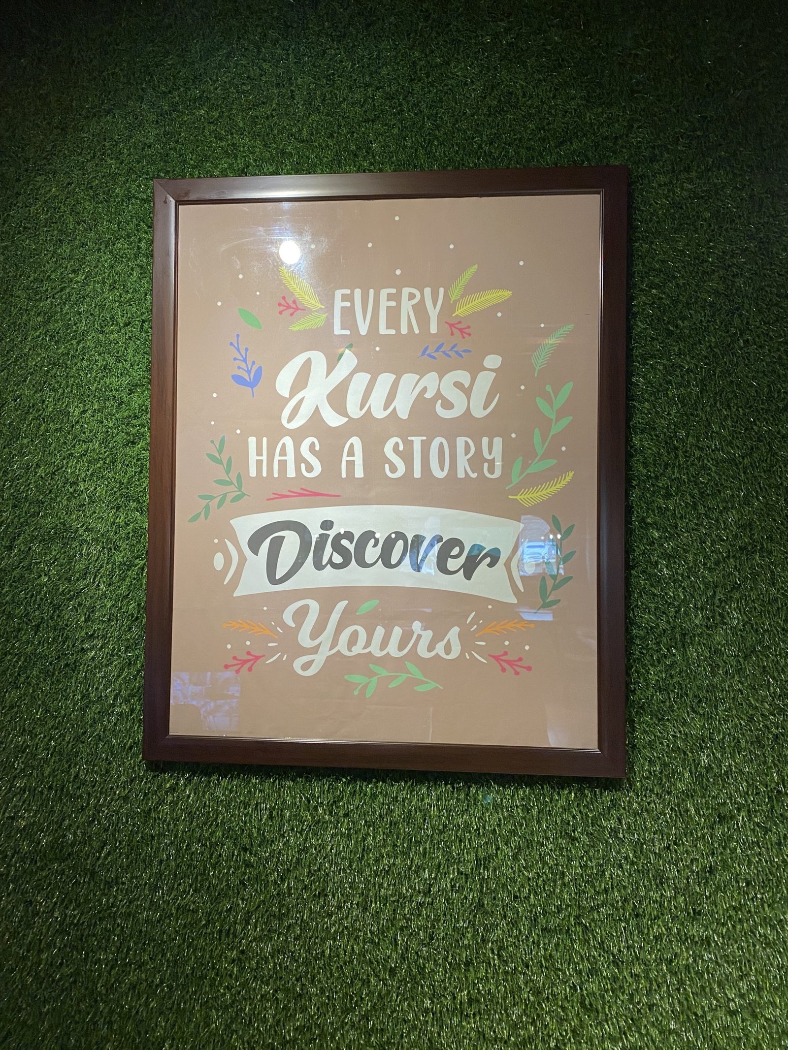 Grass wall with poster